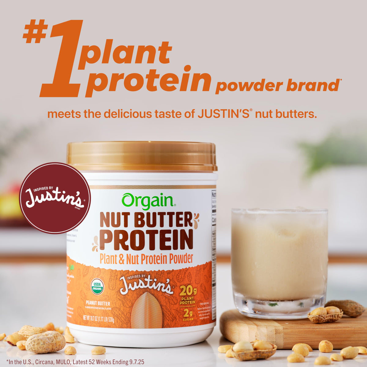 Smooth, creamy shake poured from a glass featuring Orgain Nut Butter Protein Powder.