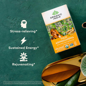 Organic India tulsi-ashwagandha herbal tea cup with steam.