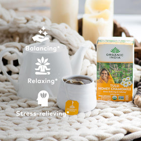 Packaging shows USDA Organic seal and non-GMO credentials for Organic India tea.