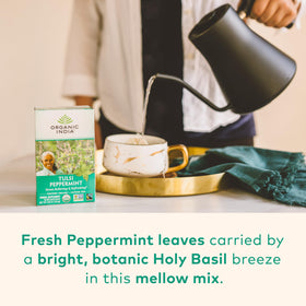 Cup for steeping ORGANIC INDIA Tulsi Peppermint Tea releasing refreshing aroma