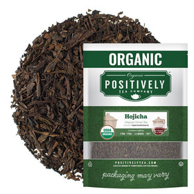 Organic Positively Hojicha loose-leaf tea being poured for a warm brew.