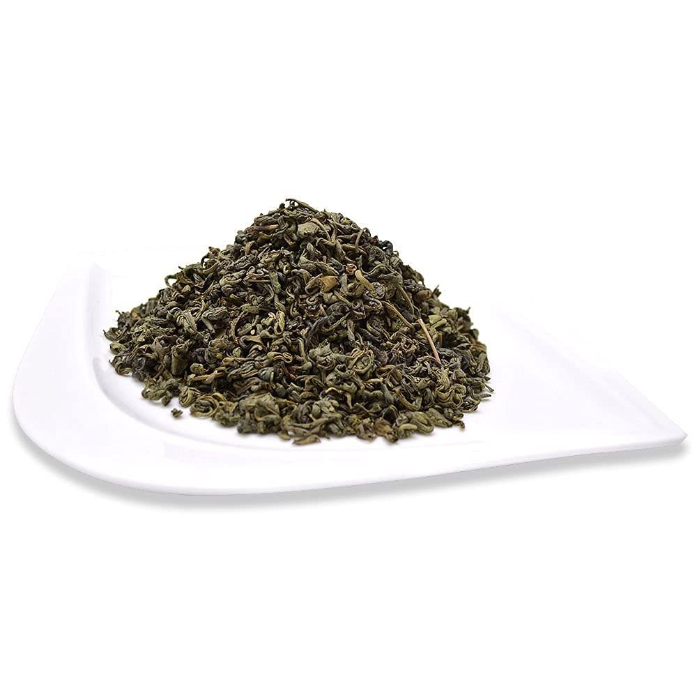 Pouring hot water over Pinhead Gunpowder leaves for a crisp, energizing cup