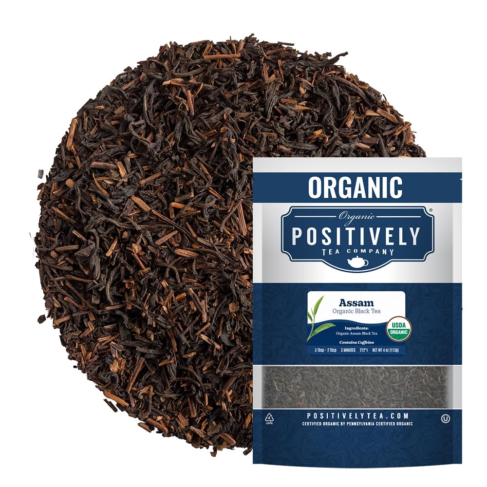 Organic Positively Tea Company Assam TGFOP loose-leaf on table, rich aroma.