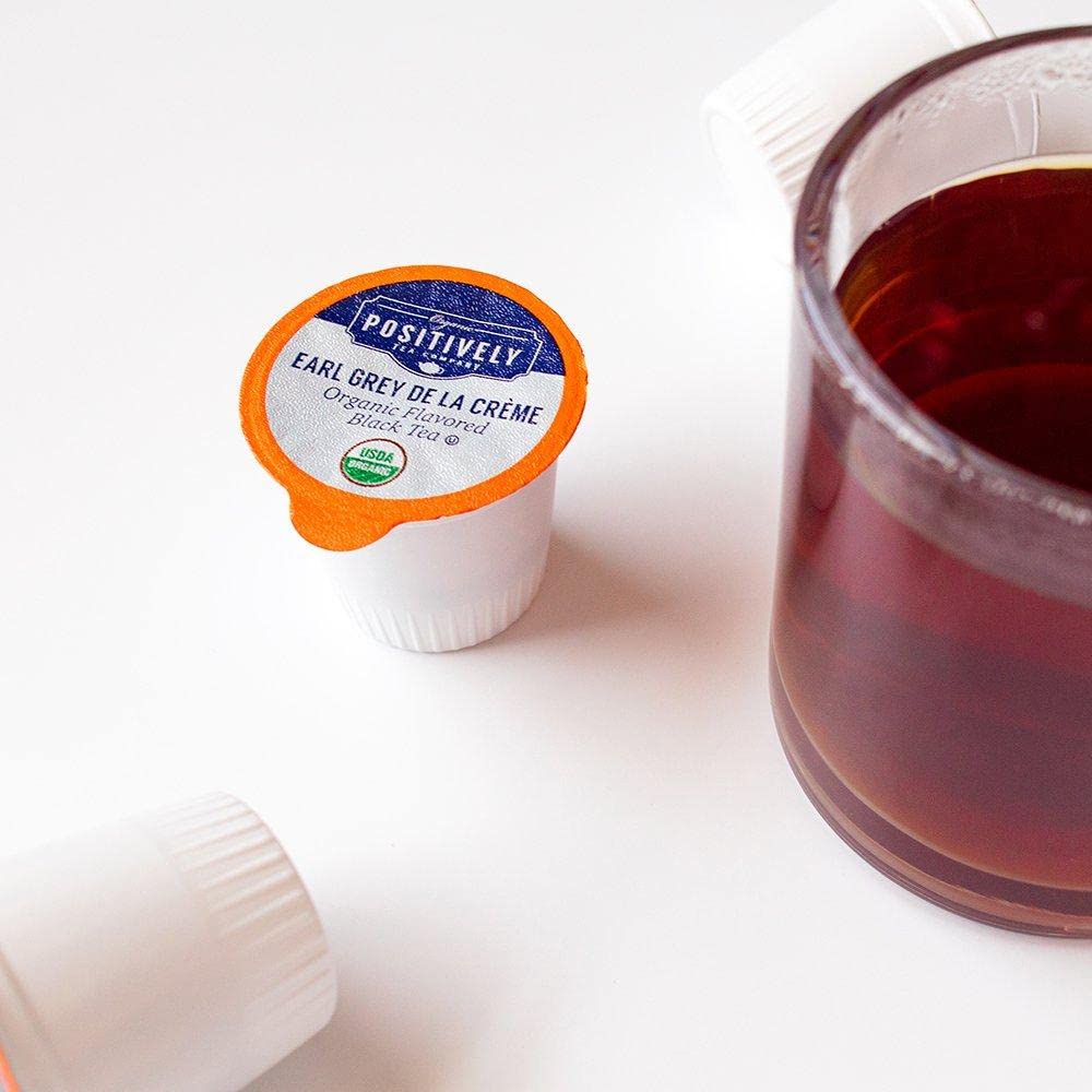 Organic Positively Tea Co brewed cup with steam for a comforting tea moment.