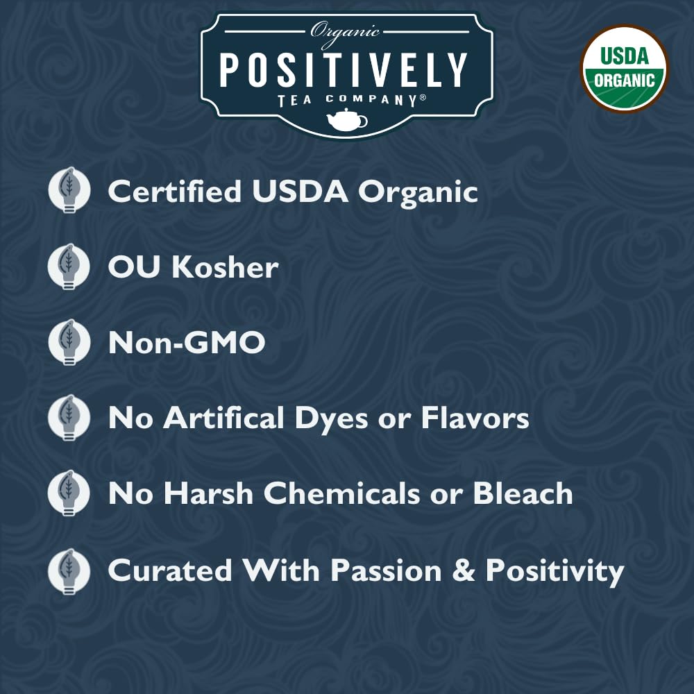 Organic Positively Tea Co steeping Earl Grey Creme in a cup yields rich amber infusion.