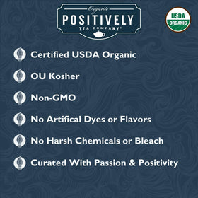 Organic Positively Tea Co steeping Earl Grey Creme in a cup yields rich amber infusion.