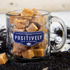 Organic Positively Tea Company caramel black tea swirl in teacup hints at caramel richness.