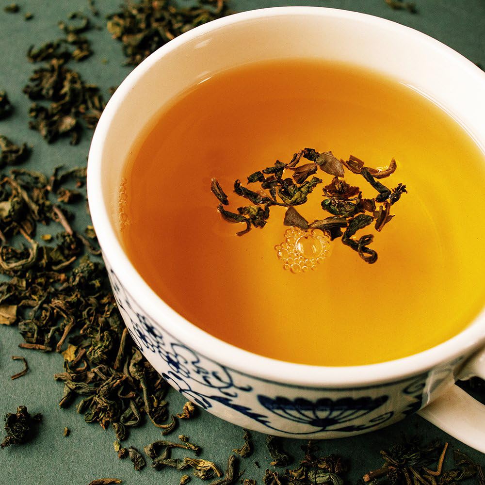 Organic Positively Tea Company Jasmine Green Tea steeped infusion, amber hue