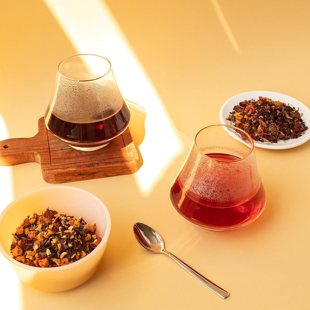 Organic Positively Tea Company's Very Berry Citrus ingredients showcase natural fruit pieces and herbs for wholesome brewing.