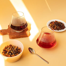 Organic Positively Tea Company's Very Berry Citrus ingredients showcase natural fruit pieces and herbs for wholesome brewing.