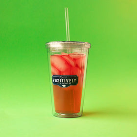 Organic Positively Tea iced hibiscus tea in a tall glass