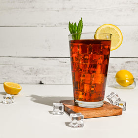A warm cup showing amber tea and inviting aroma.