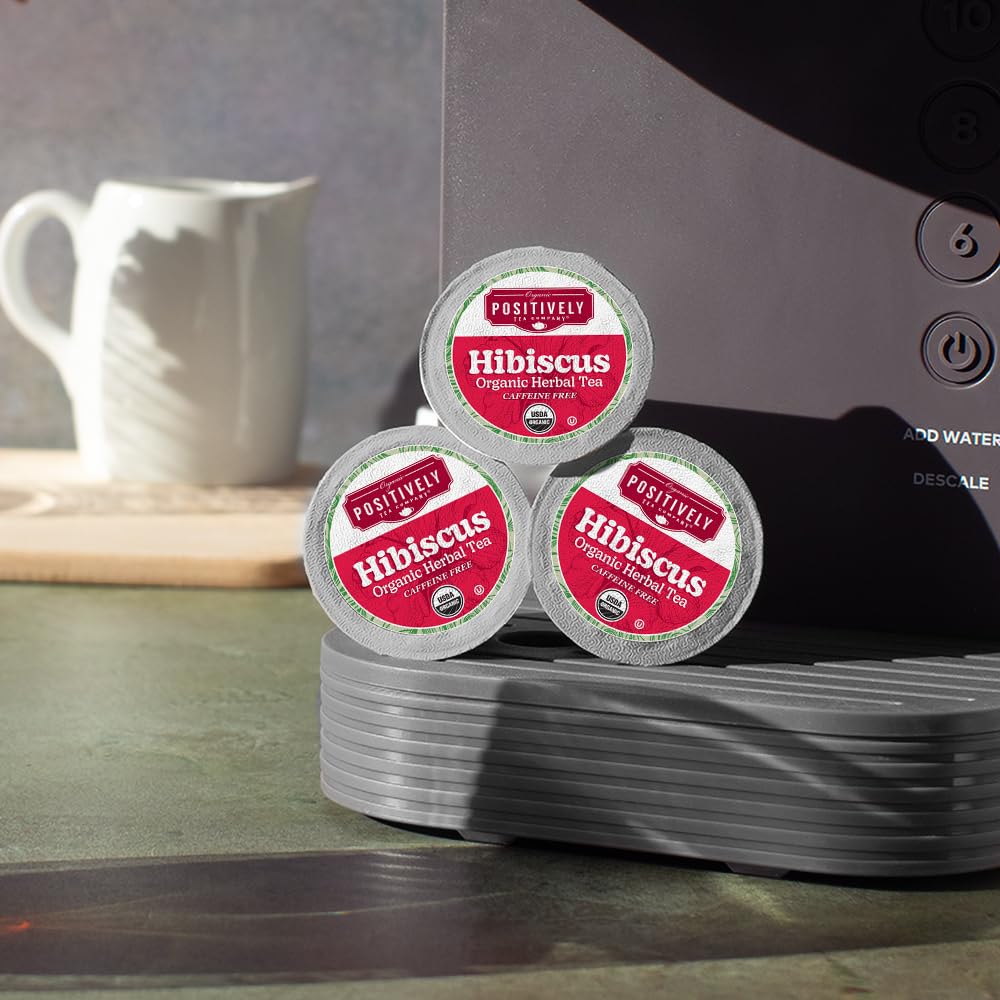 Organic Positively Tea pod recycling symbol highlights sustainable packaging