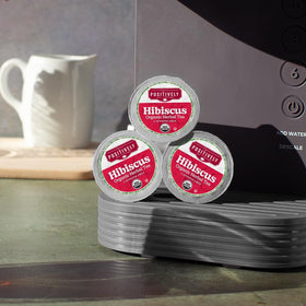 Organic Positively Tea pod recycling symbol highlights sustainable packaging