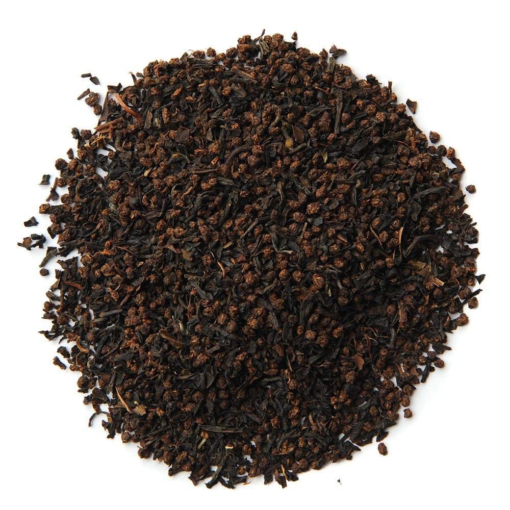 Organic Positively Tea Company Scottish Breakfast close-up on dry leaves signaling quality.