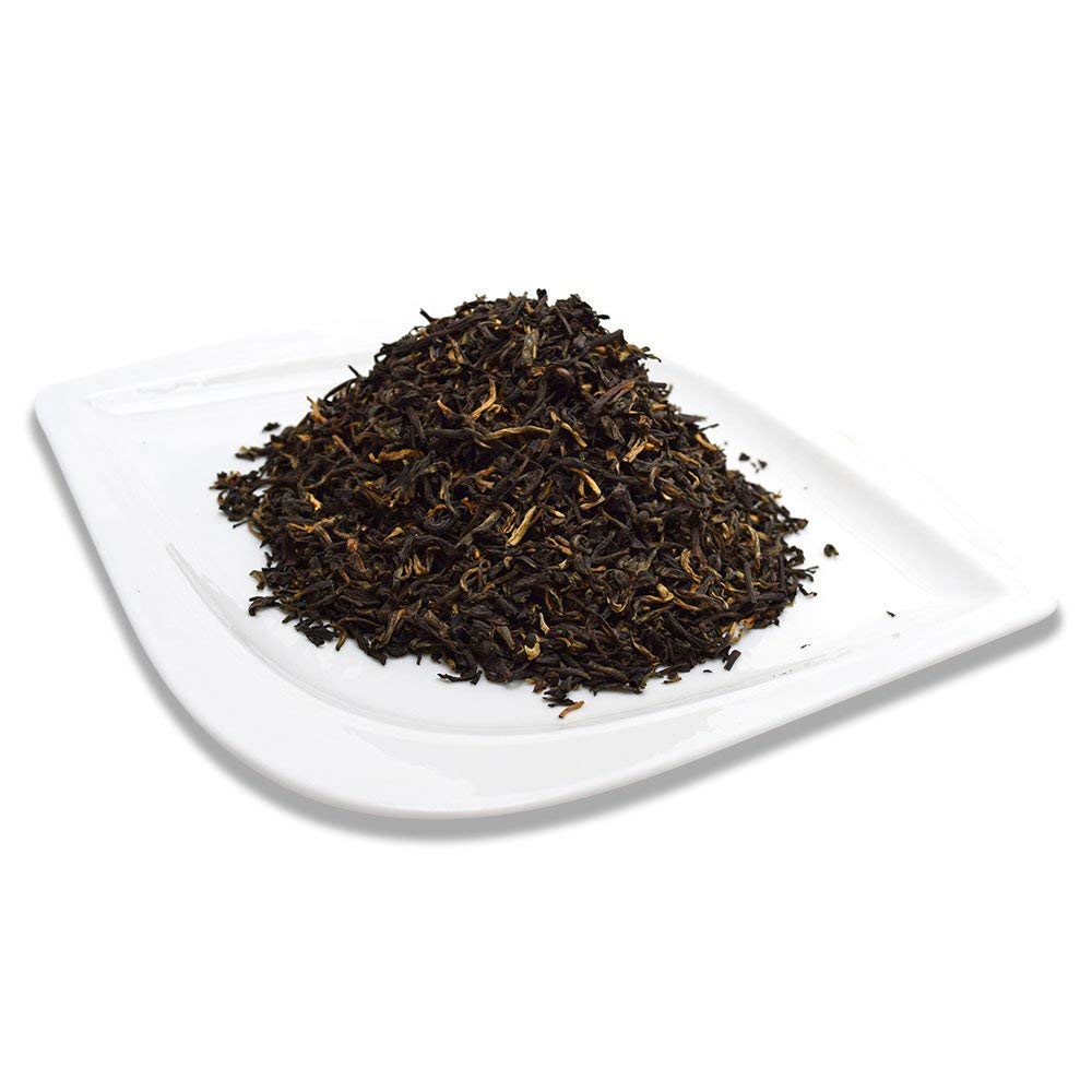 Organic Positively Tea Company Yunnan black tea high caffeine profile for daytime energy.
