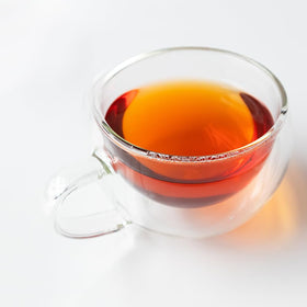 Organic Positively Tea Company Yunnan black tea packaging: 100% organic ingredients label.