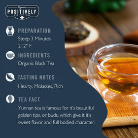 Organic Positively Tea Company Yunnan black tea leaves brewing to a deep golden infusion.