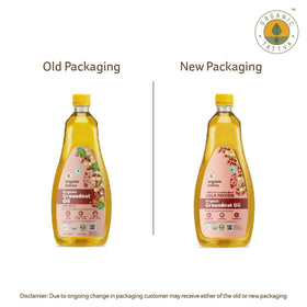 Organic Tattva groundnut oil amber bottle closeup highlighting purity.