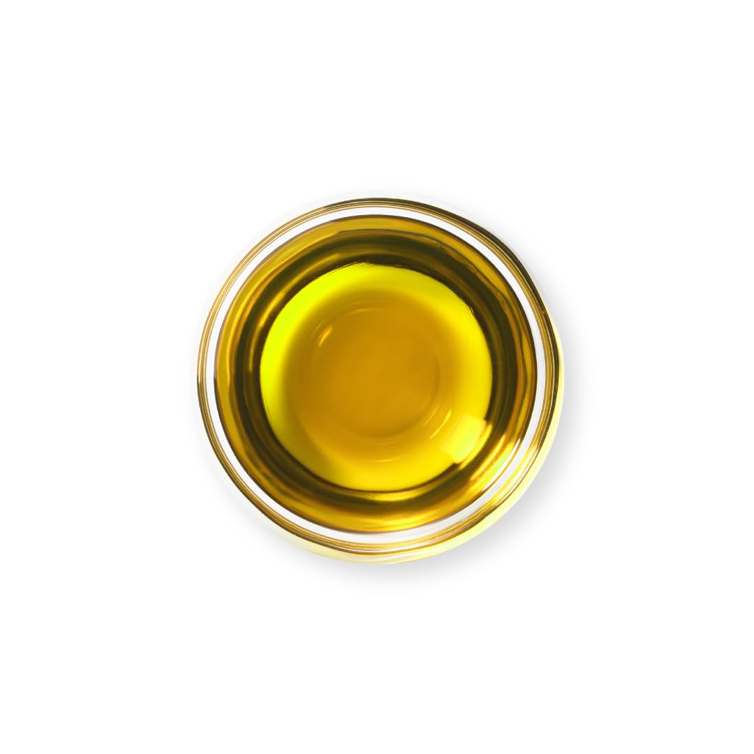 Organic Tattva groundnut oil label shows vitamin-rich composition for healthy meals.