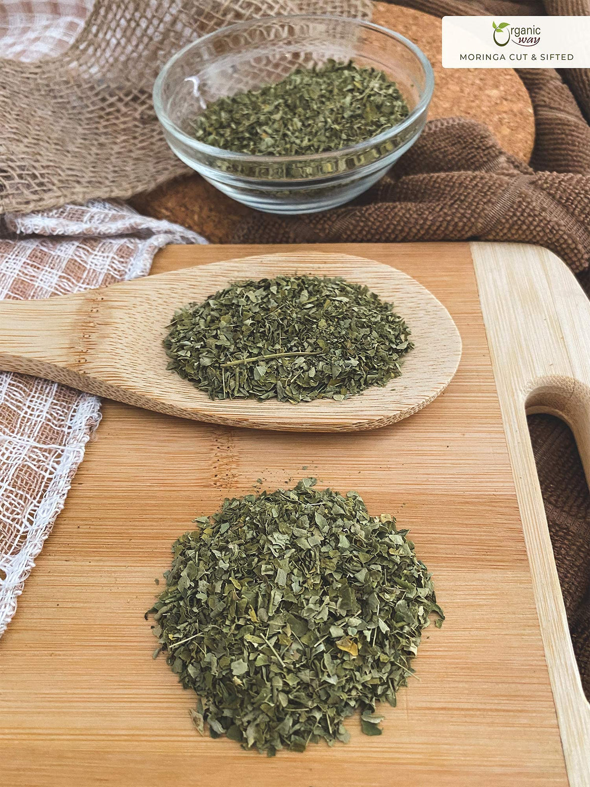 Organic Way Moringa leaves on a shelf for organized display of natural botanicals.