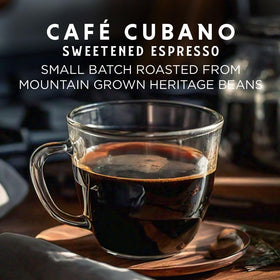 Oriente Sweetened Espresso Pods 18ct cup with steam highlights rich aroma and single-serve convenience.