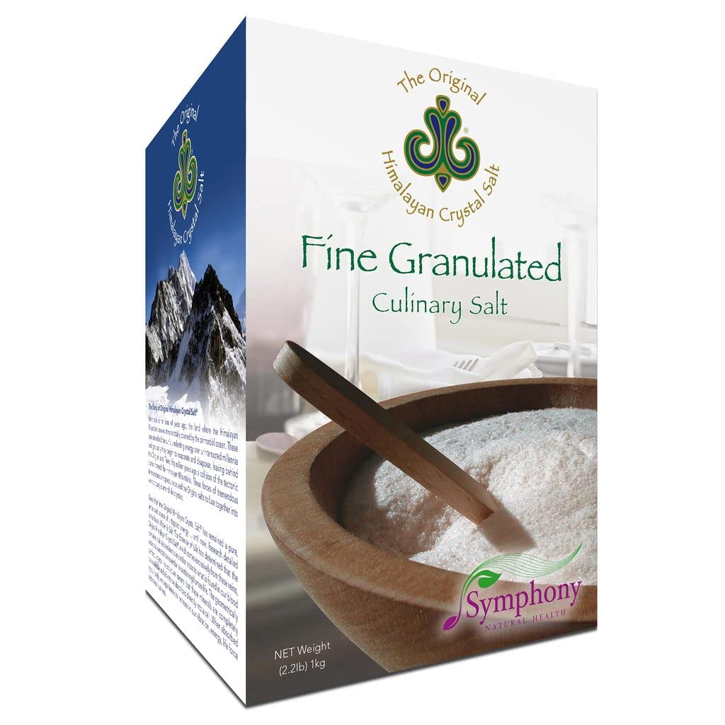 The Original Himalayan Crystal Salt sprinkling onto roasted vegetables for balanced flavor.
