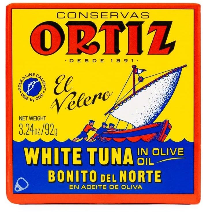 Ortiz white tuna open can closeup illustrating moist flaky tuna