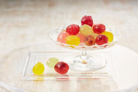 OSK Kororo white peach gummy close-up showcasing bright flavor and soft texture.