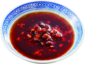 Noodles tossed with OSK chili oil delivering mild, balanced heat.