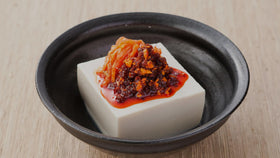 Serving plate featuring OSK chili oil as a ready-to-use condiment for meals.