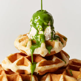 Osulloc Green Tea Milk Spread packaging on store shelf for premium presence.