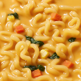 OTOKI Creamy cheddar broth close-up, rich texture.