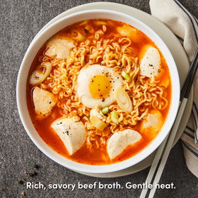 Uncooked OTOKI Jin Ramen Mild Cup noodles in a cup