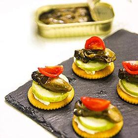 Otter Kingdom oysters in olive oil, wood-smoked flavor enhances appetizers