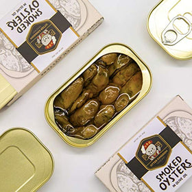 Otter Kingdom smoked oysters in olive oil can close-up showing rich coating.