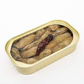 Otter Kingdom smoked oysters in olive oil close-up highlighting rich texture and smoky aroma.