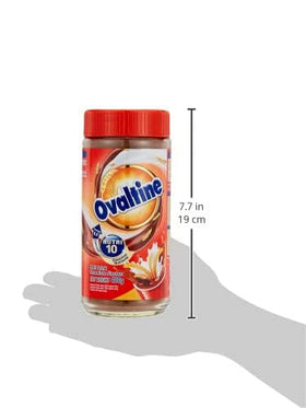 Ovaltine Power 10 malt powder being poured into a mug
