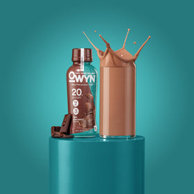 OWYN 12-pack on shelf, convenient dairy-free protein for busy days.