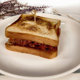 Ox and Palm Corned Beef Original Chunky sandwich assembly shot for easy lunch ideas.
