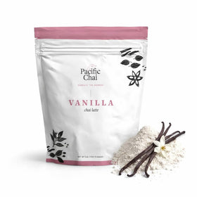 Pacific Chai Vanilla Chai Latte Mix bottle on a kitchen shelf, ideal for cozy mornings.
