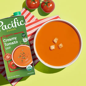 Pacific Foods Organic Creamy Tomato Soup served in bowl, creamy texture and comforting aroma.