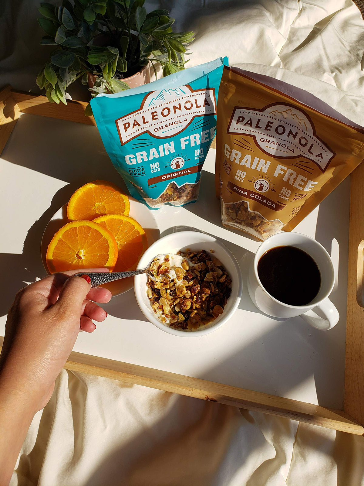 Paleonola Original granola close-up of toasted seeds and coconut oil drizzle.