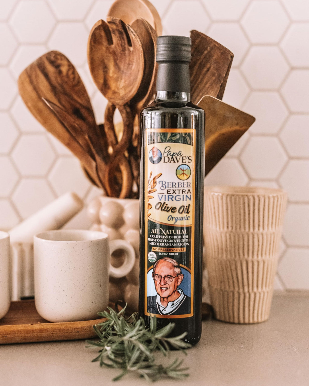 Pouring Papa Dave's olive oil to finish a dish.