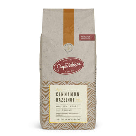 PapaNicholas Cinnamon Hazelnut coffee bag front view highlighting flavor notes.