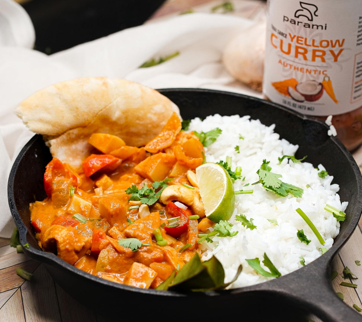 Parami Thai Curry Sauce yellow packaging with brand logo and label.