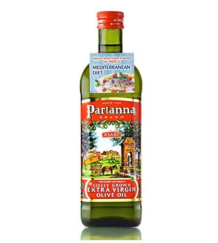 Partanna Everyday Olive Oil bottle pouring for drizzle and cooking versatility.