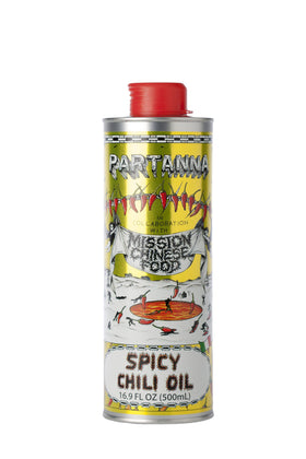 Partanna Mission Spicy Pepper Olive Oil bottle showcasing red pepper flakes in premium EVOO for finishing dishes.