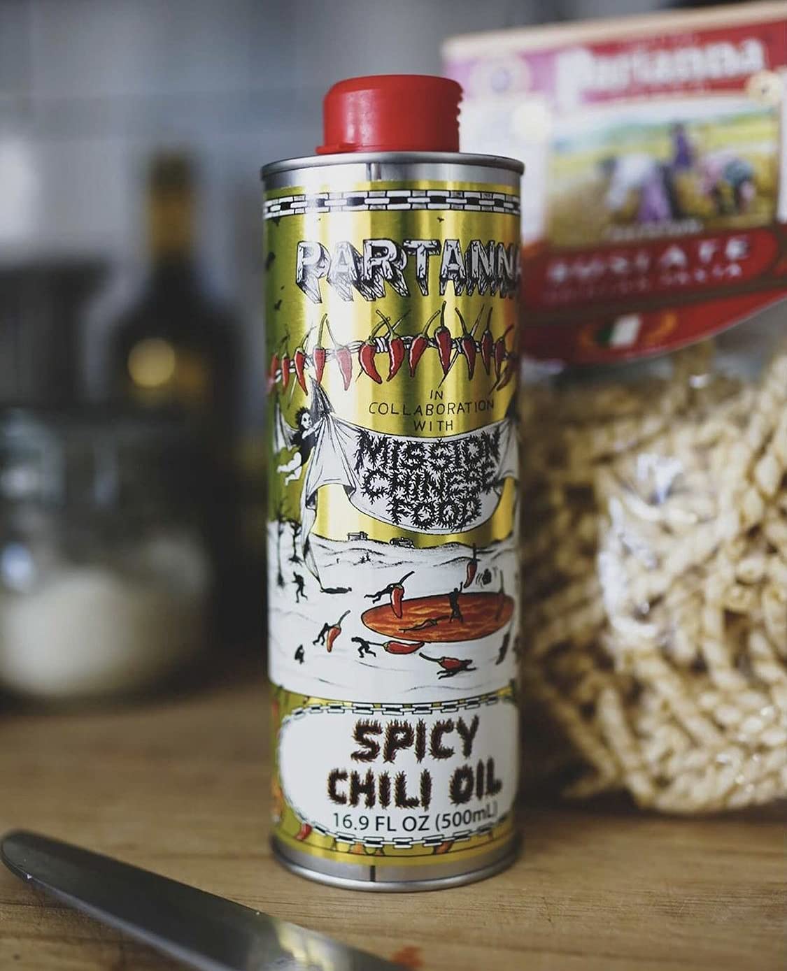 Drizzling Partanna Mission Spicy Oil over pasta to add heat and depth.