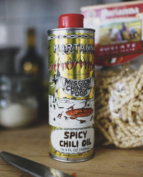 Drizzling Partanna Mission Spicy Oil over pasta to add heat and depth.